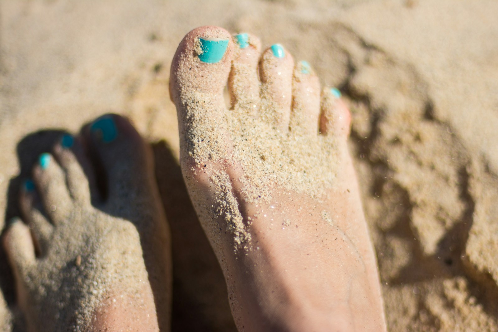 Active senior staying mobile on the beach after foot and ankle treatment